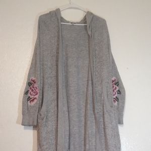 A grey floral sleeved cardigan with hood